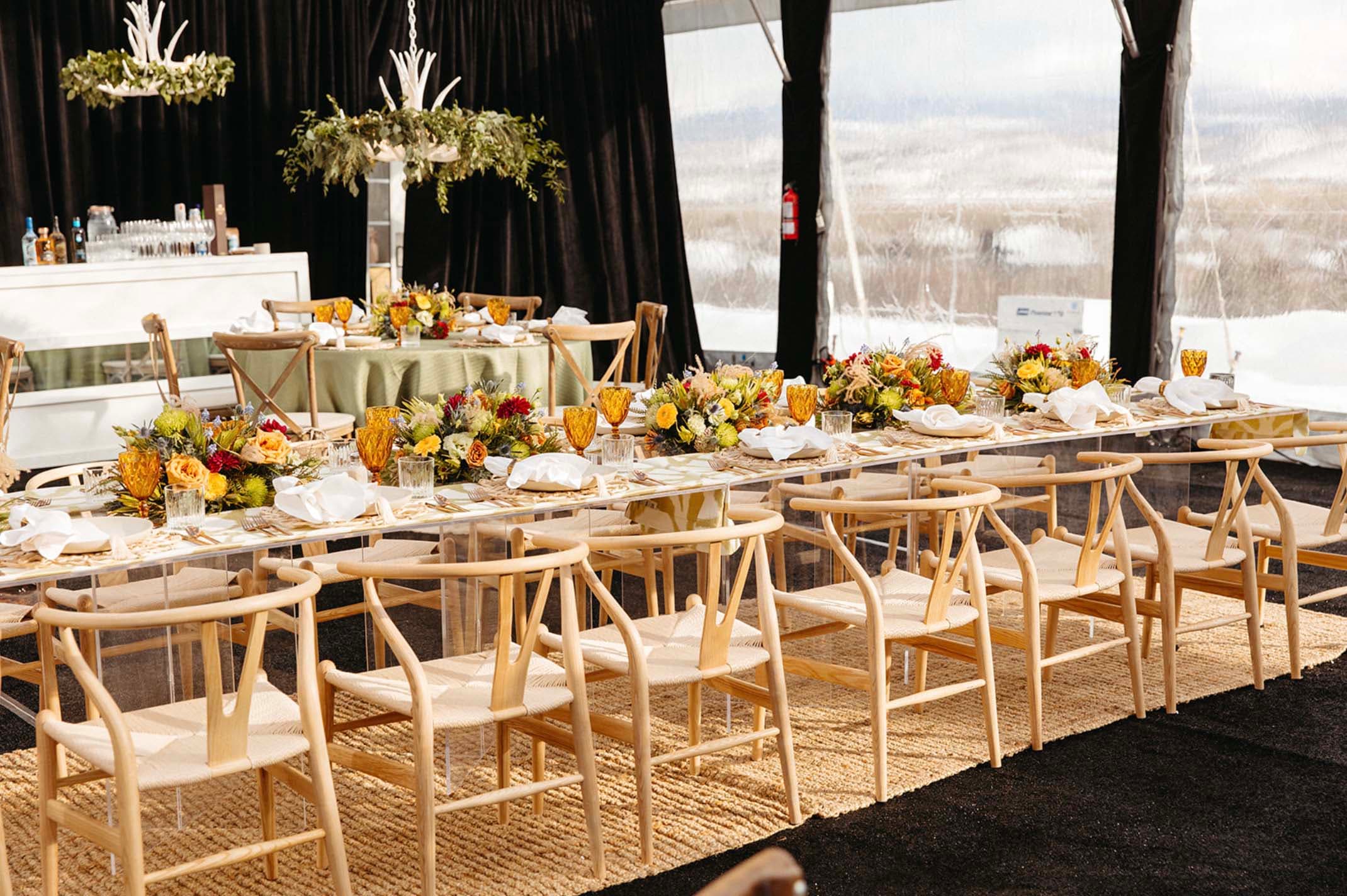 Elegant kosher catering tables arranged with floral centerpieces for a private event