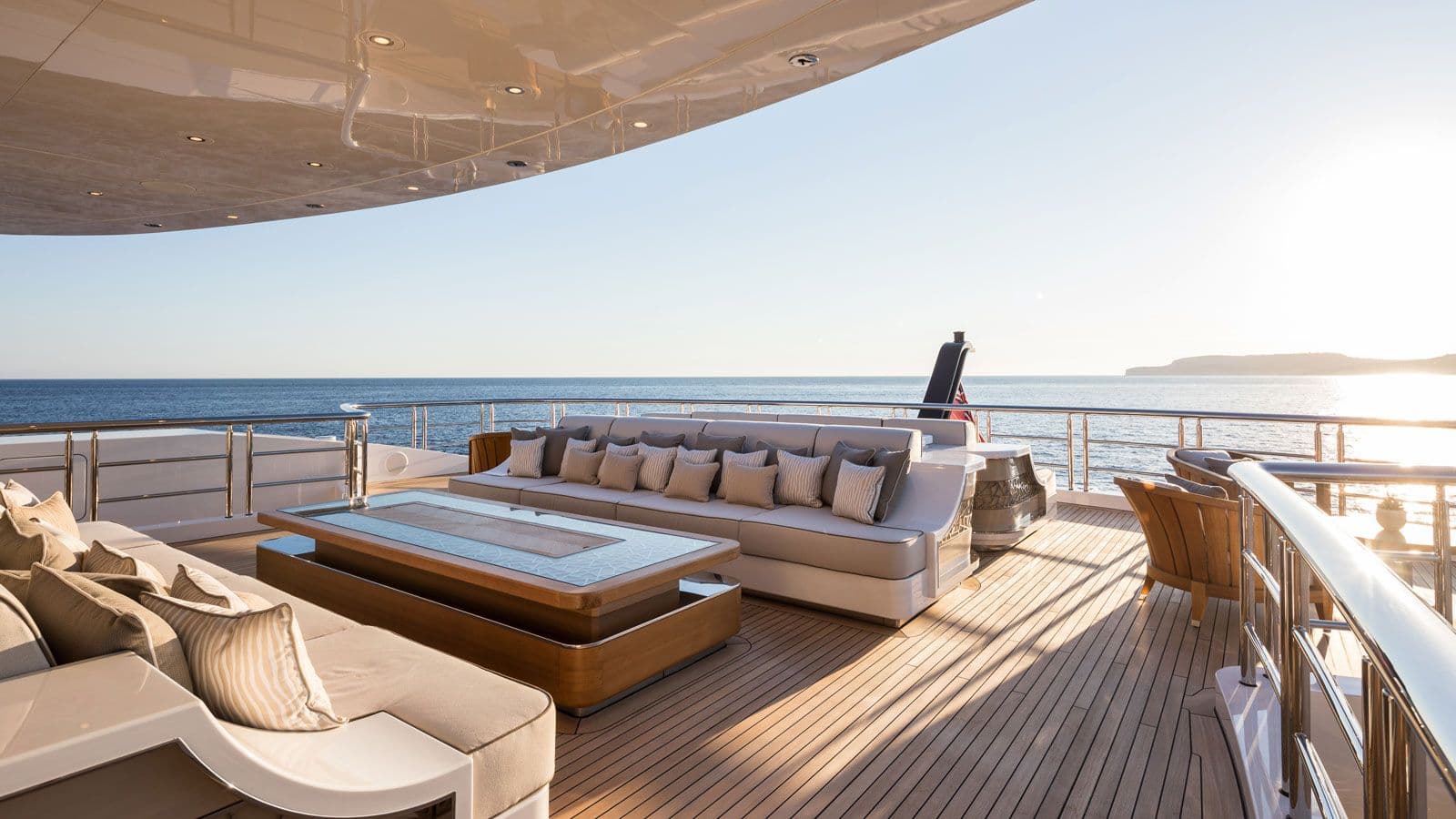 Elegant luxury yacht deck overlooking the sea at sunset