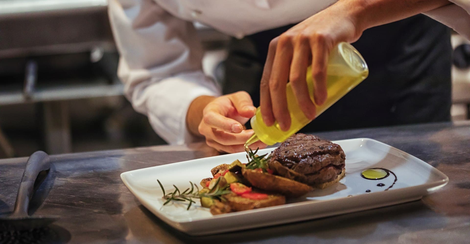Luxury kosher private chef finishing an elegant plated dinner